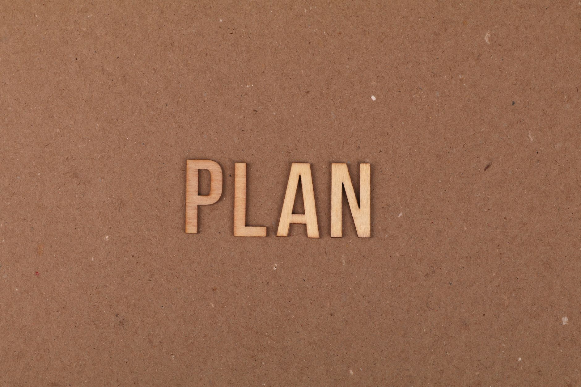 wooden alphabet letters on brown surface